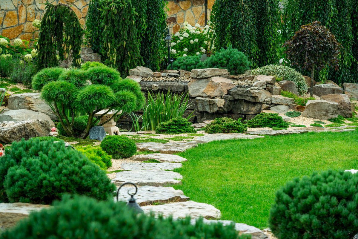 A country house with a beautiful courtyard behind the house and a swimming pool, landscape design